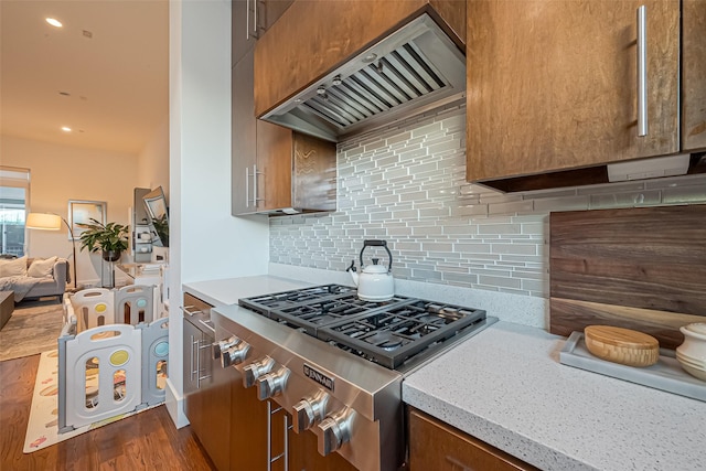 1510 Yale St Unit B, Houston, TX 77008 - kitchen with stainless steel gas cooktop, premium range hood, dark wood-style flooring, and decorative backsplash