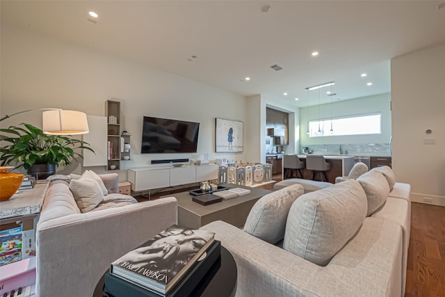 1510 Yale St Unit B, Houston, TX 77008 - living room featuring wood finished floors and recessed lighting
