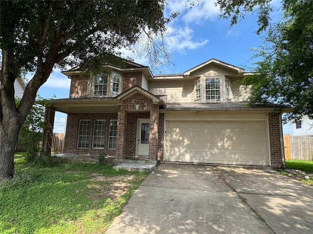 3505 Stonegate Cir, Pearland, TX 77584 - traditional-style home with brick siding, driveway, fence, and a garage