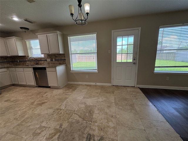 3505 Stonegate Cir, Pearland, TX 77584 - kitchen featuring dishwasher, a sink, healthy amount of natural light, and baseboards