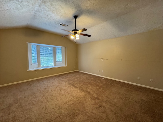3505 Stonegate Cir, Pearland, TX 77584 - empty room with vaulted ceiling, a textured ceiling, ceiling fan, carpet floors, and baseboards