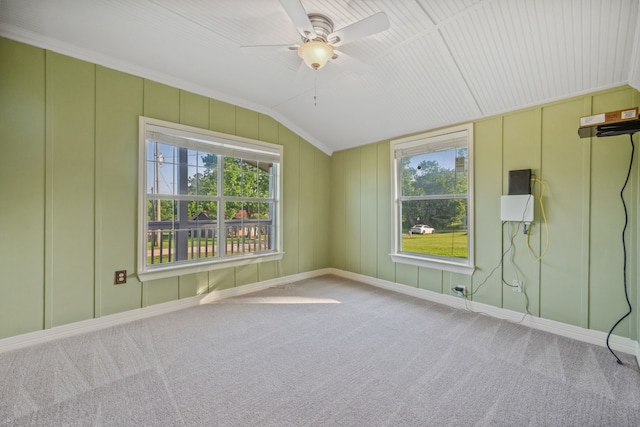 381 N Shady Oaks Dr, Point Blank, TX 77364 - carpeted empty room with plenty of natural light, vaulted ceiling, ceiling fan, baseboards, and a decorative wall