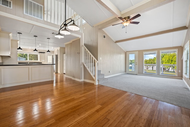 381 N Shady Oaks Dr, Point Blank, TX 77364 - unfurnished living room with a ceiling fan, light wood-style floors, stairs, baseboards, and a sink