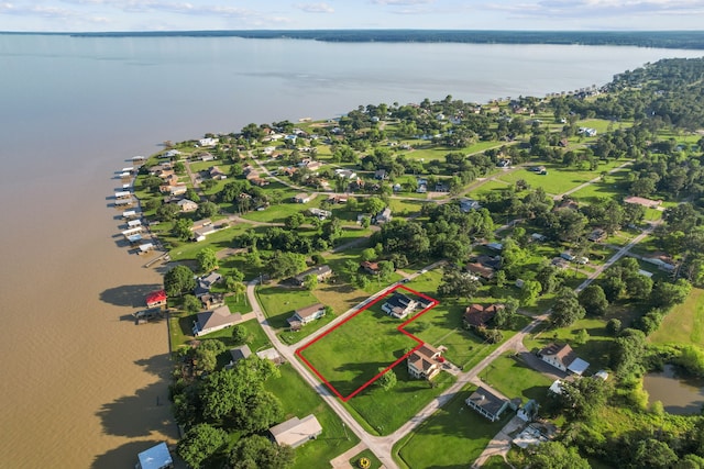 381 N Shady Oaks Dr, Point Blank, TX 77364 - aerial view of residential area with a large body of water and property parcel outlined