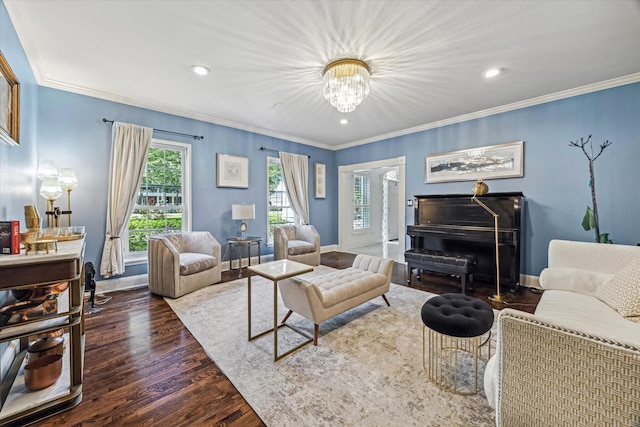living area with a chandelier, wood finished floors, baseboards, recessed lighting, and ornamental molding