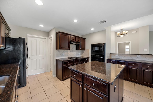 kitchen with black appliances, light tile patterned flooring, a chandelier, backsplash, and recessed lighting