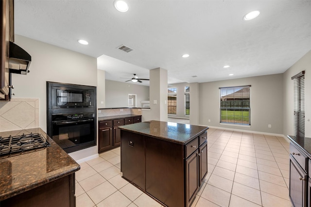 kitchen with black appliances, open floor plan, dark brown cabinets, light tile patterned floors, and recessed lighting