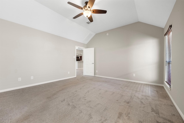 unfurnished bedroom with vaulted ceiling, carpet, a ceiling fan, and baseboards