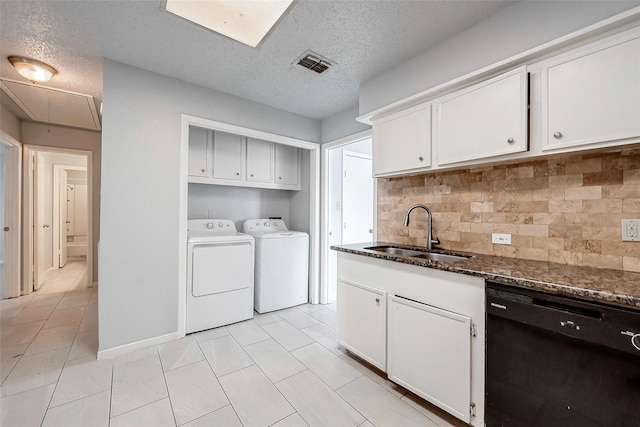 11526 Sands Point Dr, Houston, TX 77072 - washroom with washer and clothes dryer, cabinet space, a textured ceiling, attic access, and light tile patterned flooring
