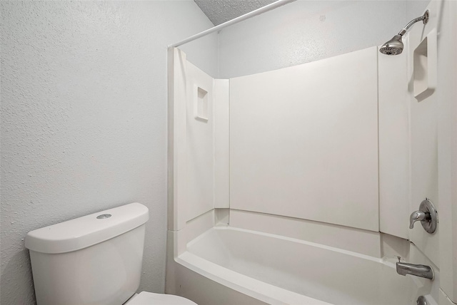 11526 Sands Point Dr, Houston, TX 77072 - bathroom featuring toilet, bathing tub / shower combination, and a textured wall