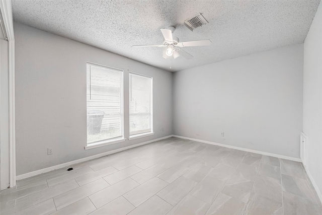 11526 Sands Point Dr, Houston, TX 77072 - empty room featuring a ceiling fan, a textured ceiling, and baseboards