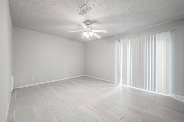 11526 Sands Point Dr, Houston, TX 77072 - spare room with ceiling fan, a textured ceiling, and baseboards