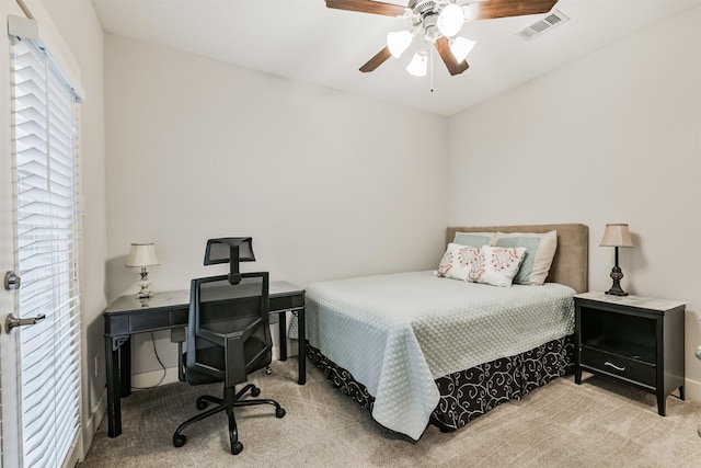 carpeted bedroom featuring ceiling fan and baseboards