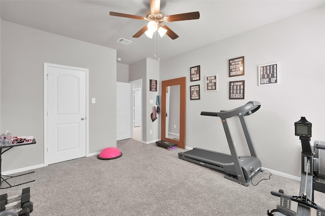 11510 Gingerland Dr, Conroe, TX 77304 - exercise room with a ceiling fan, carpet floors, and baseboards