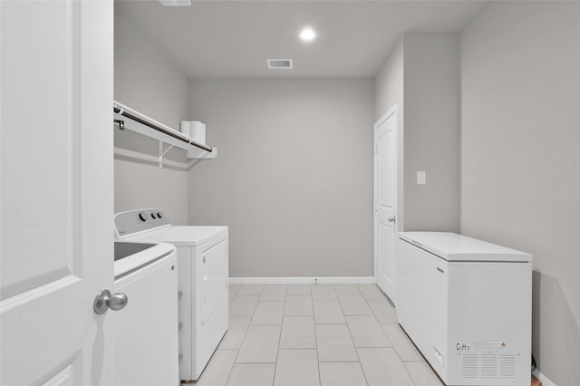 11510 Gingerland Dr, Conroe, TX 77304 - laundry room featuring separate washer and dryer, baseboards, light tile patterned flooring, and recessed lighting