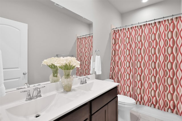 11510 Gingerland Dr, Conroe, TX 77304 - bathroom featuring toilet, double vanity, tile patterned floors, curtained shower, and recessed lighting