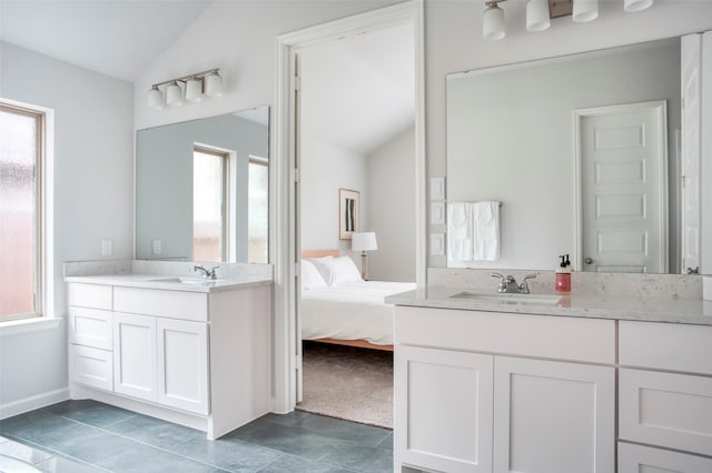 30142 Gold Finch Pl, Fulshear, TX 77441 - ensuite bathroom with vaulted ceiling, plenty of natural light, vanity, baseboards, and tile patterned flooring