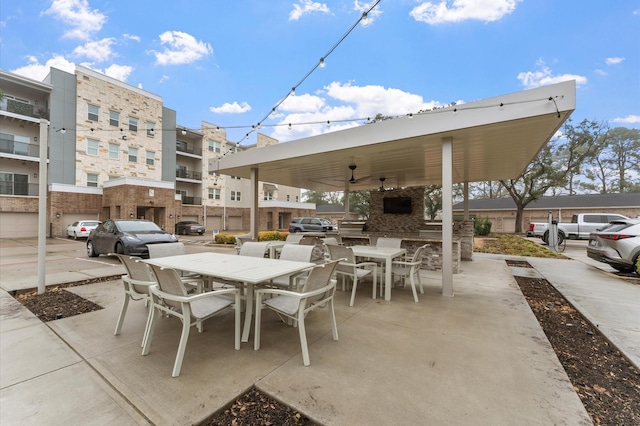 6804 Westview Dr Unit 2207, Houston, TX 77055 - view of patio with outdoor dining space and an outdoor brick fireplace