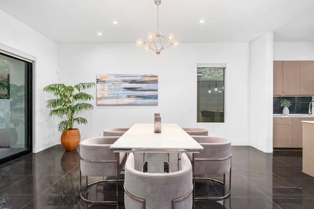 dining room featuring recessed lighting, a chandelier, granite tiled floors, and baseboards