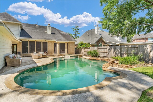16219 Haden Crest Ct, Cypress, TX 77429 - view of swimming pool featuring a fenced backyard, a patio, outdoor lounge area, a pool with connected hot tub, and a sunroom