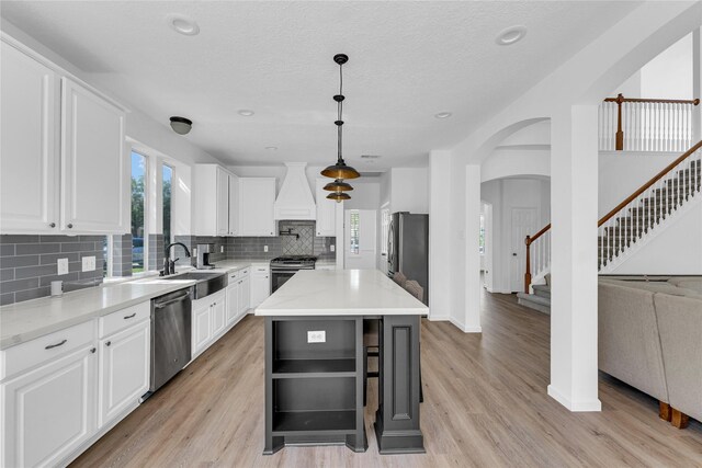 16219 Haden Crest Ct, Cypress, TX 77429 - kitchen with stainless steel appliances, decorative backsplash, white cabinets, baseboards, and recessed lighting