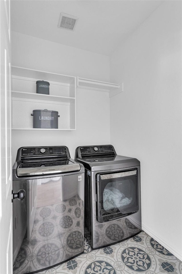 16219 Haden Crest Ct, Cypress, TX 77429 - laundry room featuring washing machine and dryer, baseboards, and tile patterned floors
