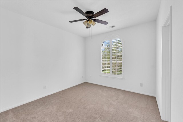 16219 Haden Crest Ct, Cypress, TX 77429 - spare room featuring carpet, baseboards, and ceiling fan