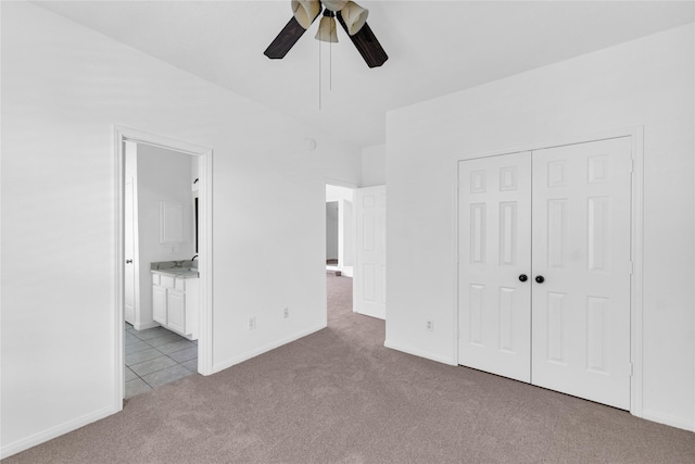 16219 Haden Crest Ct, Cypress, TX 77429 - unfurnished bedroom featuring light carpet, a closet, baseboards, and ensuite bathroom