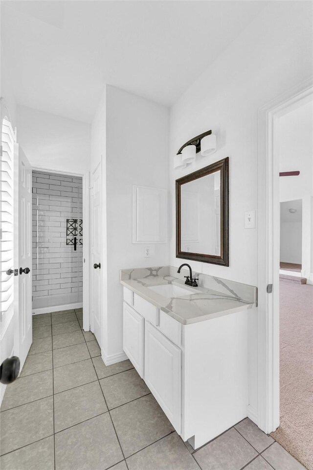 16219 Haden Crest Ct, Cypress, TX 77429 - bathroom with tile patterned floors, vanity, and baseboards