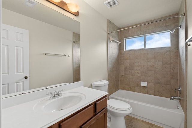 bathroom with toilet, bathtub / shower combination, vanity, and tile patterned flooring