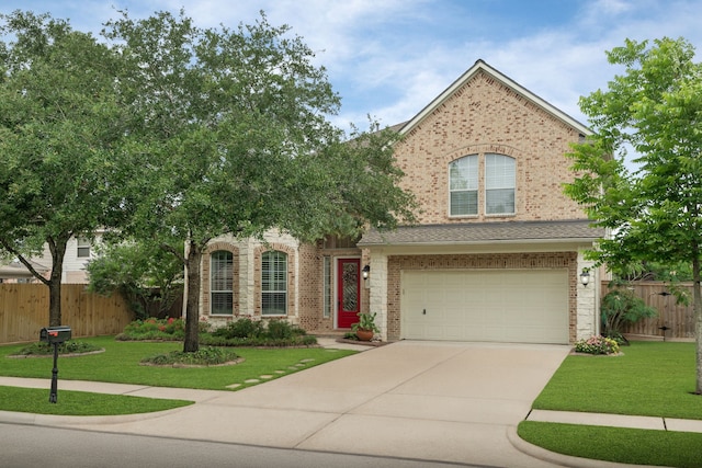 view of front facade featuring brick siding, driveway, and an attached garage