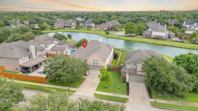aerial view of residential area with a nearby body of water