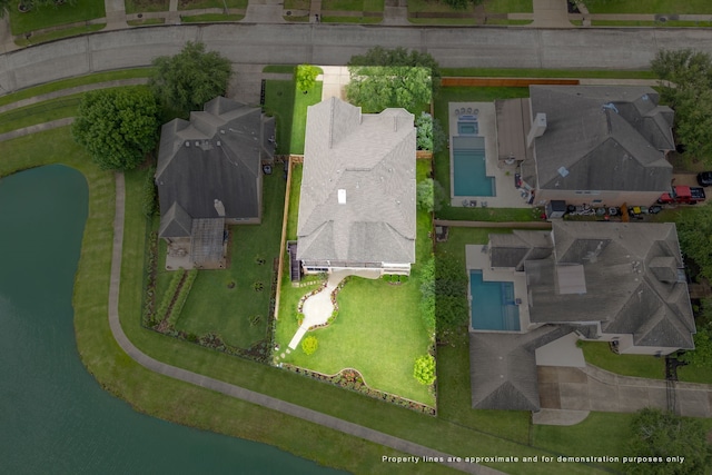 bird's eye view of a pool and a nearby body of water