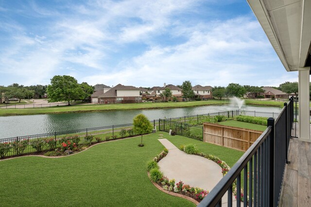balcony featuring a water view and a residential view