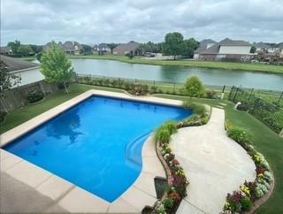 view of swimming pool featuring a water view