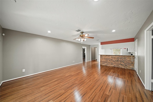 21410 Glenbranch Dr, Spring, TX 77388 - unfurnished living room featuring wood finished floors, ceiling fan, baseboards, and recessed lighting