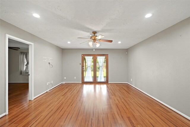 21410 Glenbranch Dr, Spring, TX 77388 - unfurnished room featuring a ceiling fan, light wood-type flooring, baseboards, recessed lighting, and french doors