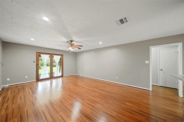 21410 Glenbranch Dr, Spring, TX 77388 - spare room with a ceiling fan, wood finished floors, baseboards, recessed lighting, and a textured ceiling