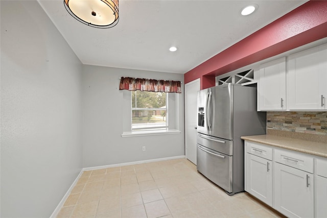 21410 Glenbranch Dr, Spring, TX 77388 - kitchen with stainless steel refrigerator with ice dispenser, white cabinets, recessed lighting, light countertops, and backsplash
