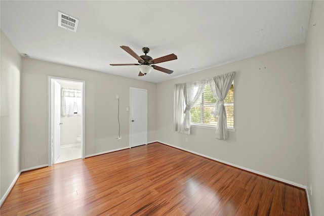 21410 Glenbranch Dr, Spring, TX 77388 - spare room with wood finished floors, a ceiling fan, and baseboards