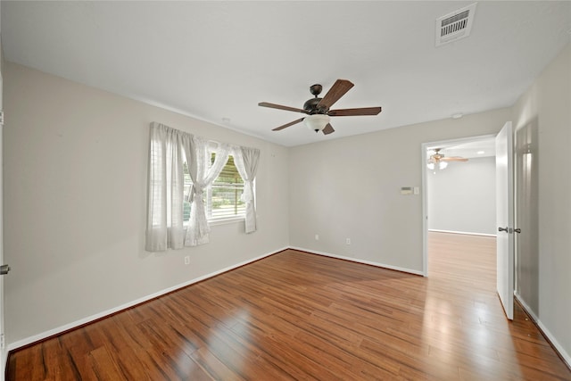 21410 Glenbranch Dr, Spring, TX 77388 - spare room with wood finished floors, a ceiling fan, and baseboards