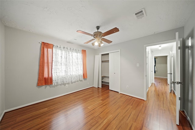 21410 Glenbranch Dr, Spring, TX 77388 - unfurnished bedroom with light wood finished floors, baseboards, a closet, and ceiling fan