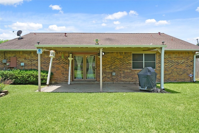 21410 Glenbranch Dr, Spring, TX 77388 - back of property with brick siding, a patio, and a yard