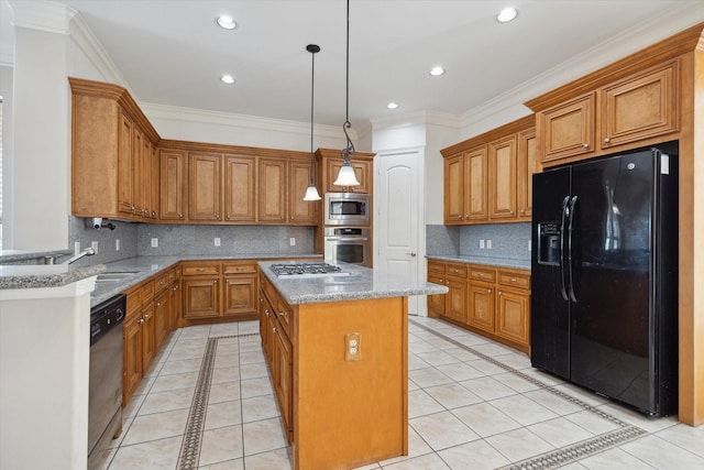 kitchen featuring stainless steel appliances, brown cabinets, a center island, a sink, and light stone countertops