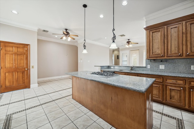 kitchen with a ceiling fan, a sink, light tile patterned floors, a kitchen island, and recessed lighting