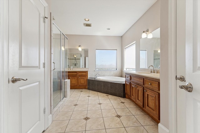 full bath with vanity, a bath, a stall shower, and tile patterned flooring