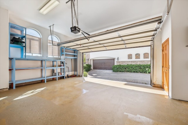 garage featuring a garage door opener