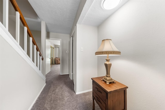 1924 Clipper Ct, Willis, TX 77318 - hallway with dark colored carpet, stairway, and baseboards