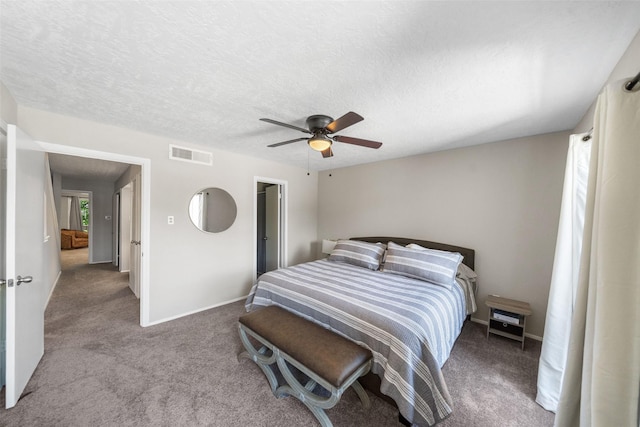 1924 Clipper Ct, Willis, TX 77318 - bedroom featuring carpet flooring, ceiling fan, baseboards, and a textured ceiling