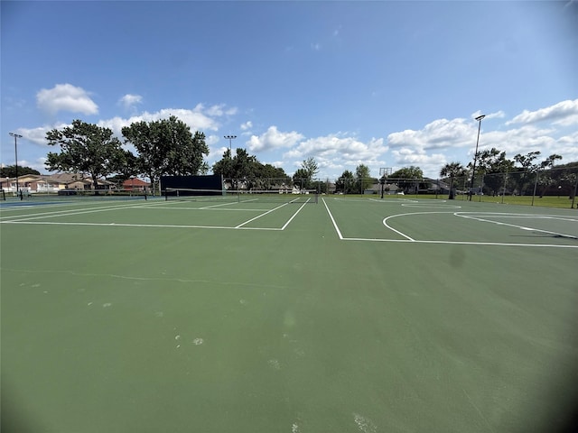 1924 Clipper Ct, Willis, TX 77318 - view of basketball court featuring a tennis court, fence, and community basketball court